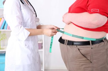 Doctor With Obese Patient
