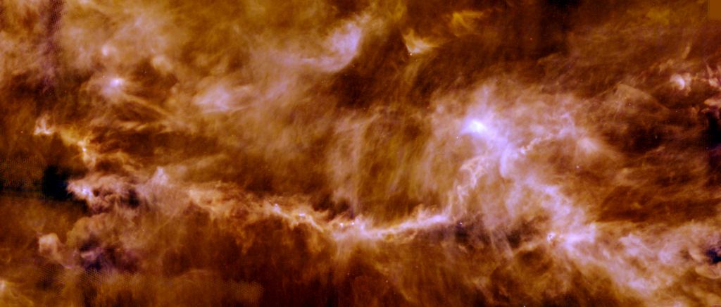 Cette image de l'observatoire spatial Herschel de l'ESA montre la distribution du gaz et de la poussière dans le nuage moléculaire Taurus. Des filaments emmêlés de gaz et de poussière se frayent un chemin à travers le nuage, et les noyaux brillants de l'image sont des protoétoiles. La nouvelle étude a révélé que certains composés organiques se formant dans le Taureau sont l'un des maillons de la chaîne chimique s'étendant du Big Bang à la Vie. Crédit image : ESA/Herschel/PACS, SPIRE/Gould Belt survey Key Programme/Palmeirim et al. 2013